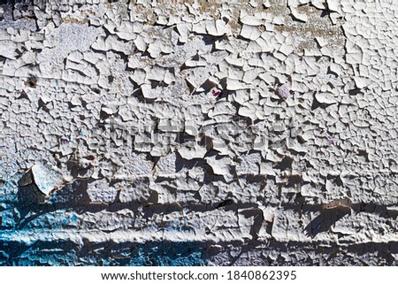 A fragment of colorful graffiti painted on a concrete wall. Abstract urban background for design.