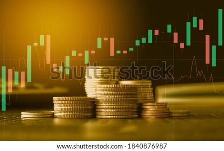 Stack of gold money coin with trading graph, financial investment concept can be use as background Royalty-Free Stock Photo #1840876987