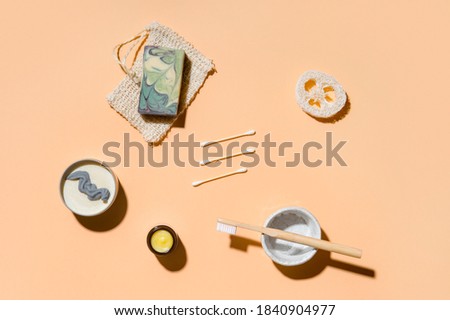 Top view of different hygiene and care items on cream color background, zero waste concept
