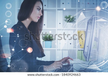 Side view of young businesswoman working in blurry office with double exposure of network interface. Toned image