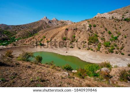Panoramic view of an mountain lake of emerald color in the Crimea
