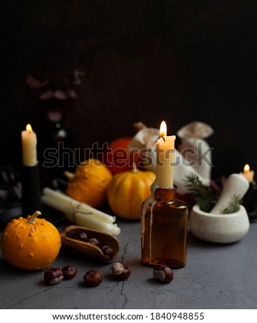 Halloween still life with candles and pumpkins 