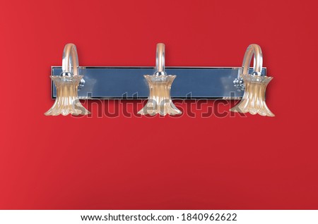 Modern wall lamp for decorate interior on red background