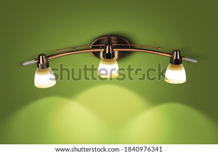 White & Metal lamp on dark green wall background