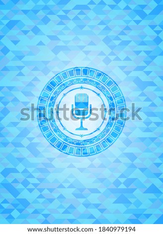 microphone icon inside sky blue emblem. Mosaic background. 