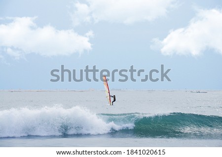Man surfing on the sea.