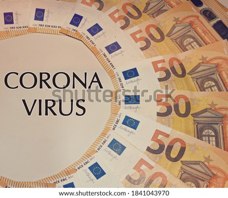 Close up of banknotes of 50 euros with a "Corona Virus" sign in the middle, concept of business during Corona Virus