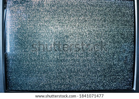 damaged tv signal on old television screen background close up