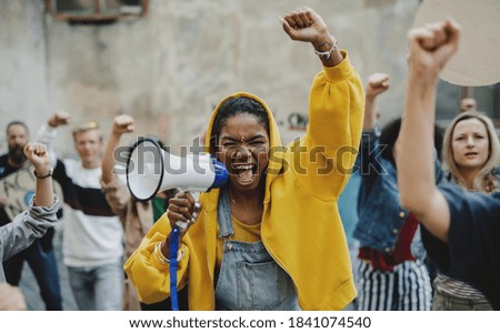 Group of people activists protesting on streets, BLM demonstration and coronavirus concept. Royalty-Free Stock Photo #1841074540