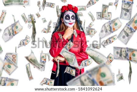 Woman wearing day of the dead costume over background with hand on chin thinking about question, pensive expression. smiling with thoughtful face. doubt concept.