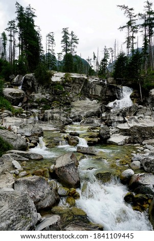 Mountain river and waterfall in High Tatras National Park, Slovakia                       