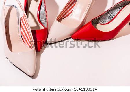 leather heeled shoes on beige background