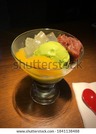 Green tea ice cream and red bean paste. Selective focus.