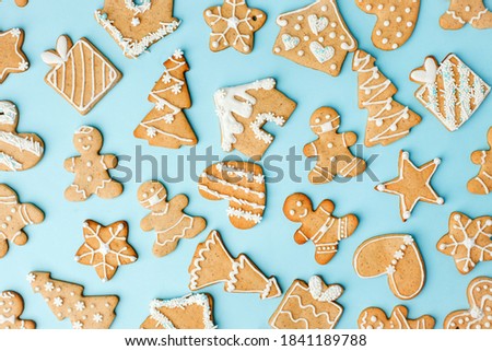 Winter Holiday pattern - set of gingerbread on light blue background - man in mask, house, xmas tree, stars, Happy New Year 2021, Merry Christmas background, trendy concept