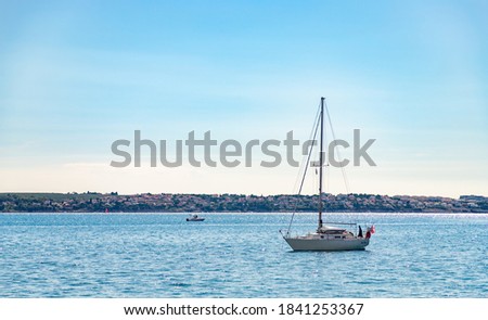 A picture of a sailboat in the Adriatic Sea waters near Portorož.