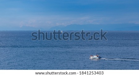 A picture of a small speedboat in the Adriatic Sea waters near Piran.