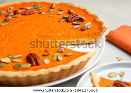 Delicious homemade pumpkin pie on light table, closeup