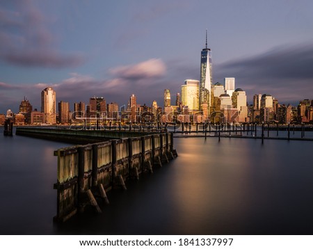 Beautiful New York Skyline,  Piers and Hudson River in Dusk