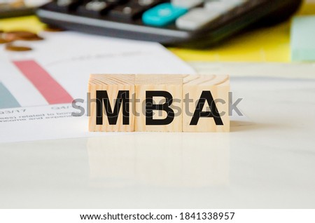 mba word written on wood block. Faqs text on table, concept. High quality photo
