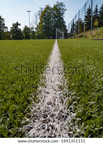 Lines on soccer football field, sport background. Green Artificial Grass Turf Field with White Line Boundary