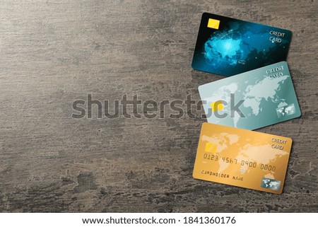 Credit cards on grey table, flat lay. Space for text