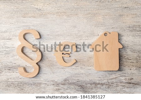 house modell with selection sign on wooden background