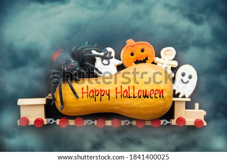 Happy Halloween cardbackground kids train with halloween cookies, Halloween Jack o Lantern pumpkin witch hat , candy and halloween Trick or Treat 