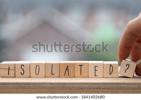 Wooden cubes with the word isolated for Coronavirus, Covid-19 and quarantaine and feeling alone background concept