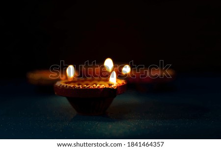 Happy Diwali - Diya lamps lit during diwali celebration