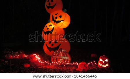 Halloween stacked pumpkins at night