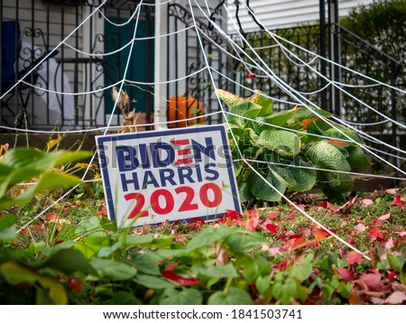 Voting sign outside a house in Somerville, US, before the presidential election 2020.