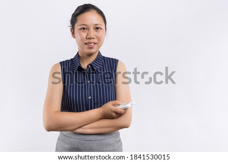 Full isolated studio picture from a young woman with remote control
