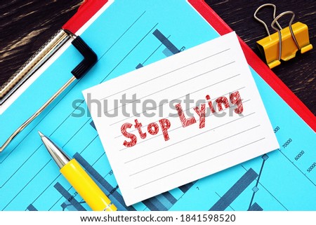 Business concept about Stop Lying  with sign on the sheet.
