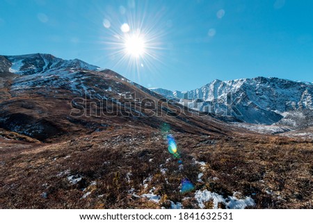 Beautiful autmn landscape in snowy mountains