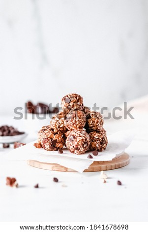 Almond Butter Bliss Balls. Healthy and Vegan Energy Balls as a healthy snack or dessert. Almond Butter energy balls with chocolate, dates and nuts.  Royalty-Free Stock Photo #1841678698
