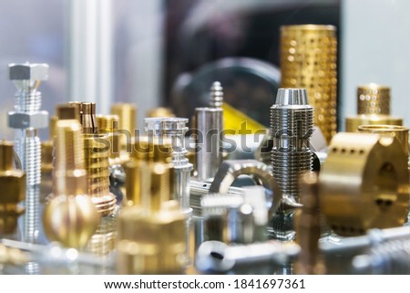 different shapes and sizes of parts turned on a lathe or milling machine. The details of processing of metal