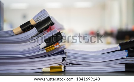 Unfinished Report of papers document folder with black clippaper. Pile a lot of agreements report sheet prepareing signature or approval from administrator check in important page on desk in office