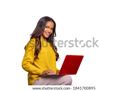 Image of cheerful African American woman using laptop. Isolated. Person and Laptop 