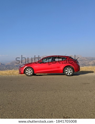Red Car and scenery arround. Royalty-Free Stock Photo #1841705008