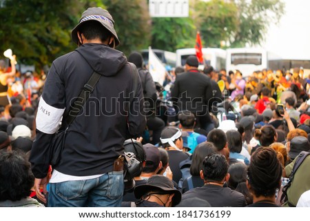 A field photographer in the center of the crowd.
