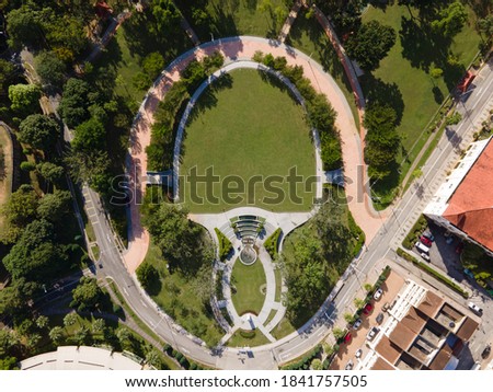 Aerial top down view of unique outdoor park surrounded by trees