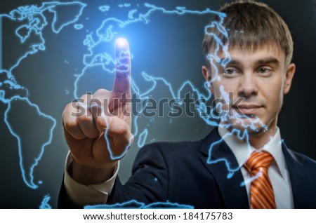 handsome businessman  finger point touch on world map, on dark blue background