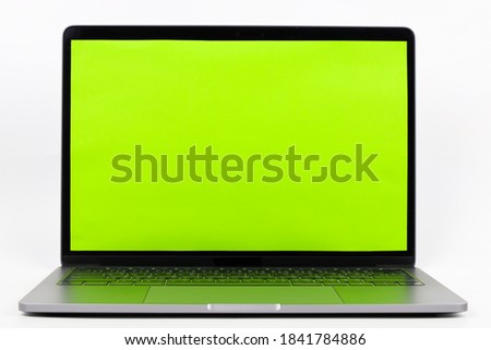 laptop computer with green screen white background.