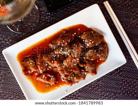 Japanese style veal meat braised in wok with soy sauce and sesame....