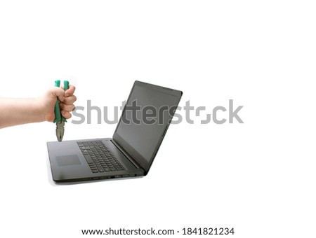 Work from home concept. Workplace with broken laptop against white background