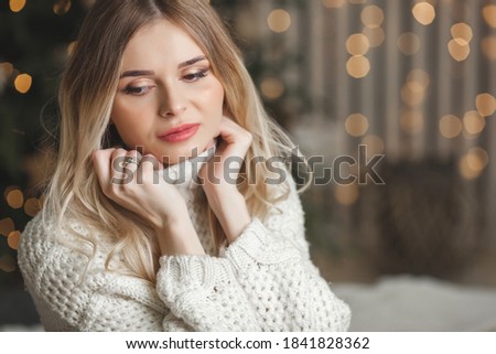 Beautiful woman on christmas background
