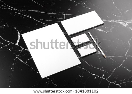 Photo of branding identity mock up on marble. Template isolated on marble background. For graphic designers presentations and portfolios marble premium luxury mock-up