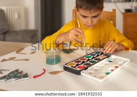 colorful paints for children, child draws at home, pastime