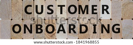 Wooden blocks with text 'customer onboarding' on beautiful wooden background. Business concept. Copy space.