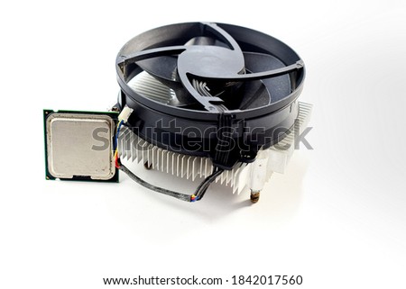 Cpu processor chip with cooling fan on white background